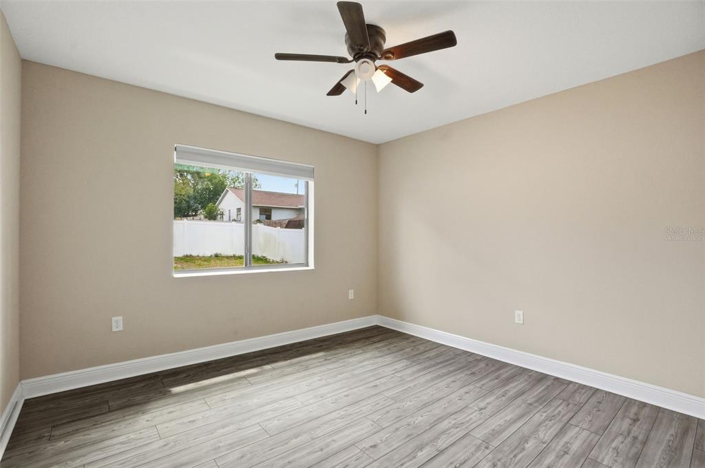 4128 Everett Avenue Spring Hill, FL 34609 - Photo 36 of 57 wooden floor in an empty room with a window