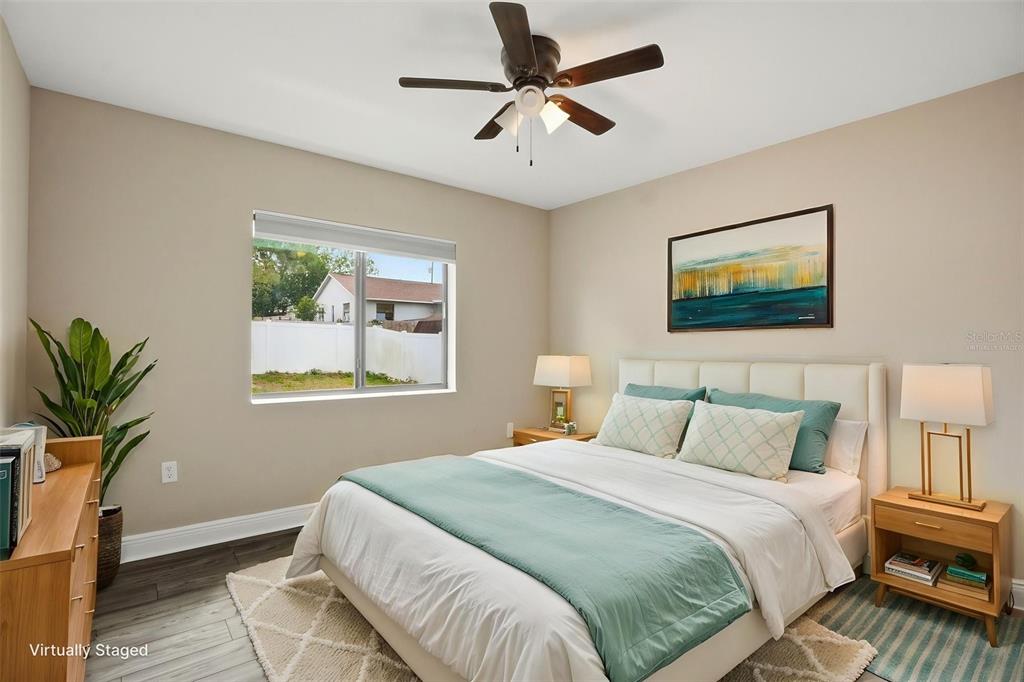 4128 Everett Avenue Spring Hill, FL 34609 - Photo 37 of 57 a bedroom with a bed and a painting on the wall