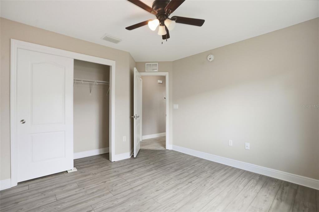 4128 Everett Avenue Spring Hill, FL 34609 - Photo 38 of 57 a view of an empty room with wooden floor