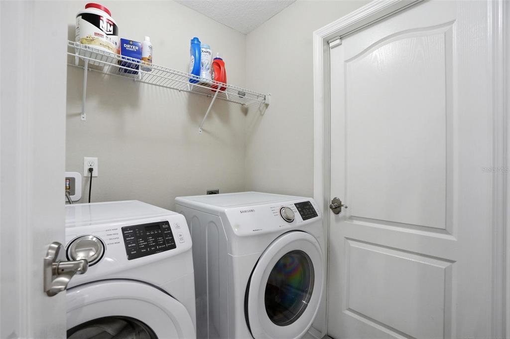 4128 Everett Avenue Spring Hill, FL 34609 - Photo 43 of 57 a utility room with dryer and washer