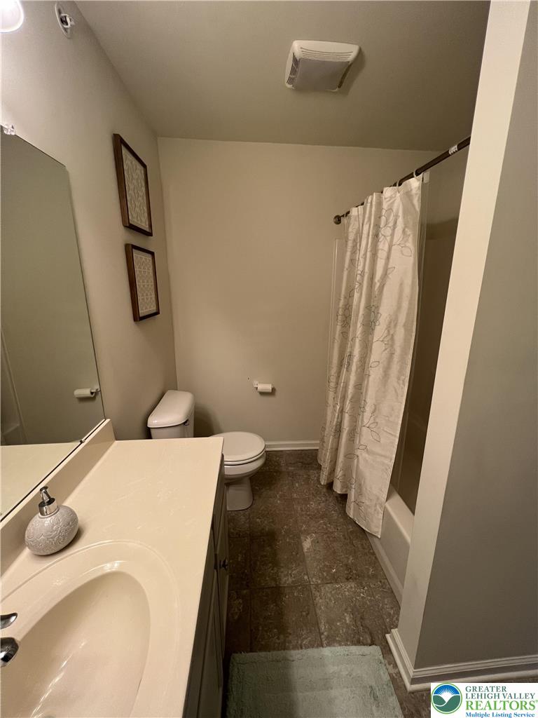 5380 Jutland Road Allentown, PA 18104 - Photo 22 of 27 Functional full bathroom featuring a tub and shower combination with a vanity sink.