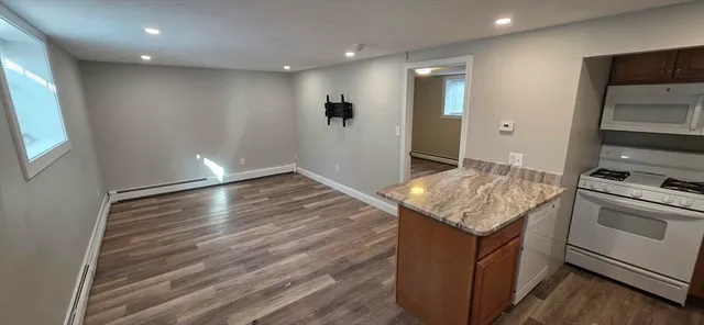 a kitchen with a sink and a stove top oven