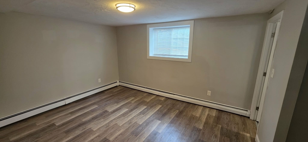 62 Cabot, Unit 2 Beverly, MA 01915 - Photo 4 of 5 a view of a room with wooden floor and window