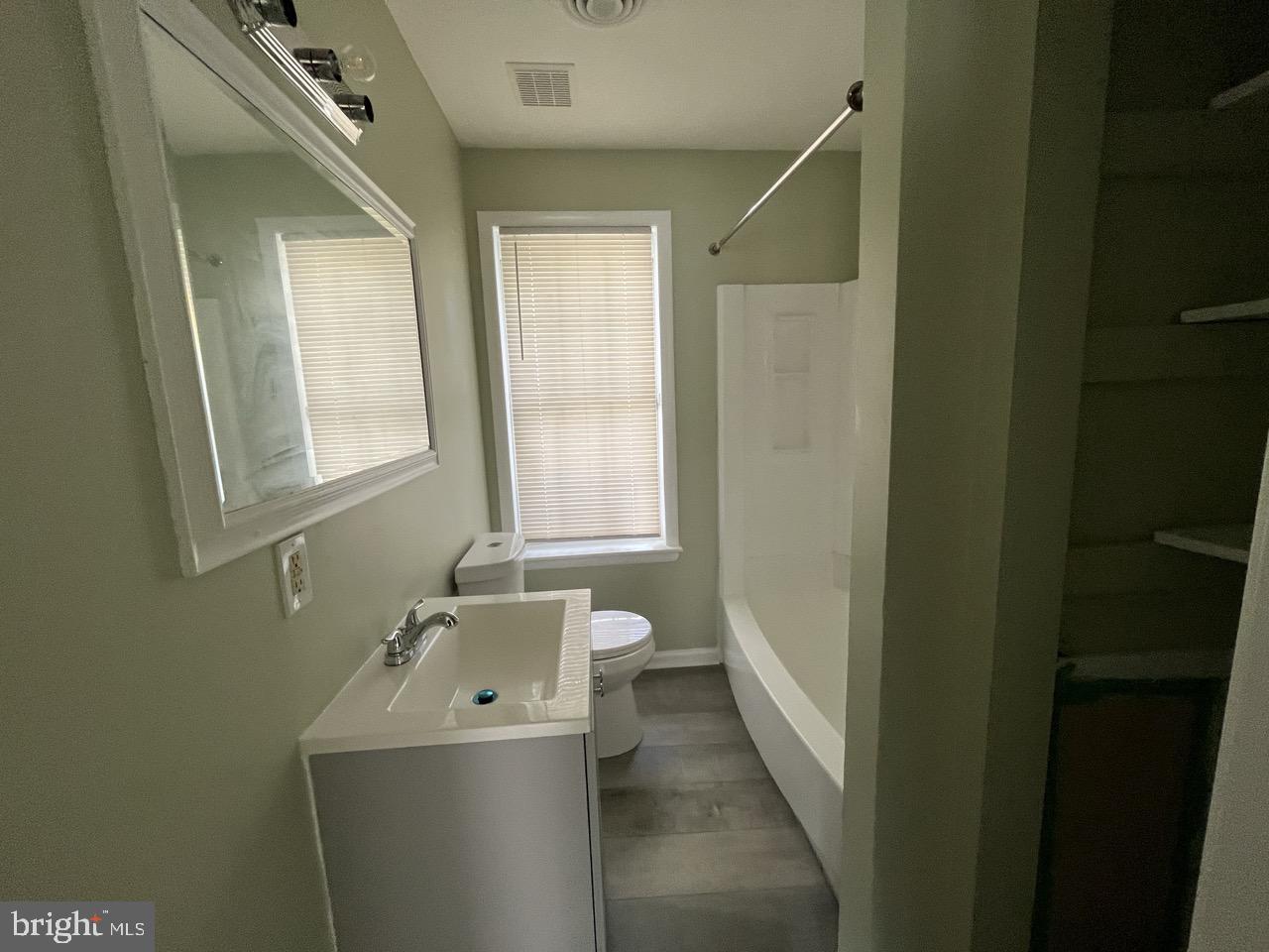 216 Kinsley Road Pemberton, NJ 08068 - Photo 14 of 19 a bathroom with a sink a toilet and a mirror