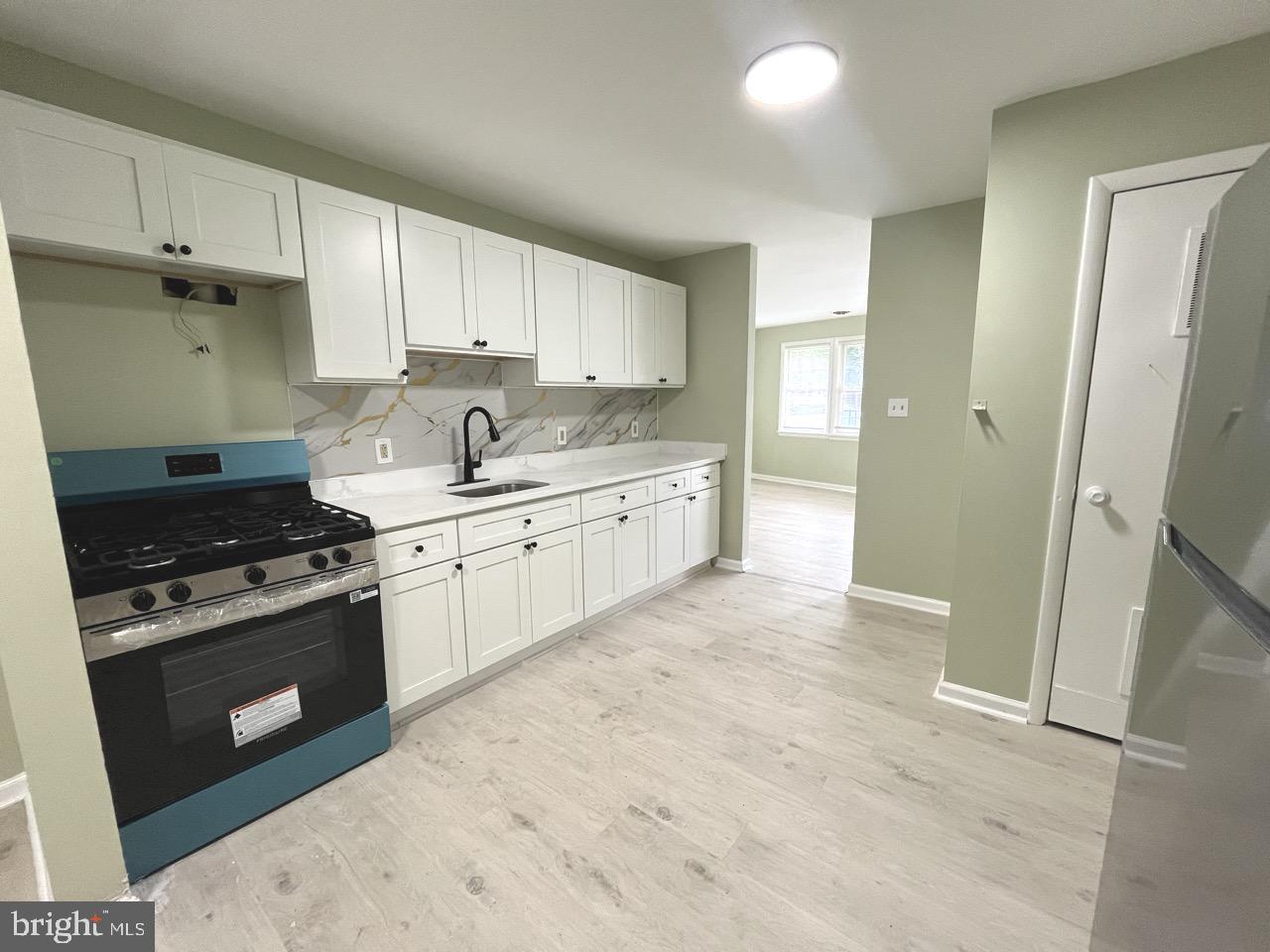 216 Kinsley Road Pemberton, NJ 08068 - Photo 5 of 19 a kitchen with stainless steel appliances granite countertop a stove and a sink