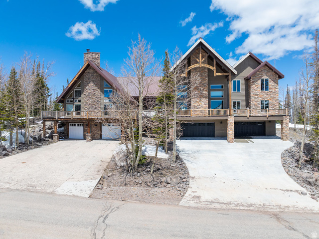 382 Ridgeview Street, Unit 8 & 9 Brian Head, UT 84719 - Photo 1 of 52 Stone and wood-sided architectural style featuring multiple gable roofs, extensive decking, and a prominent stone chimney