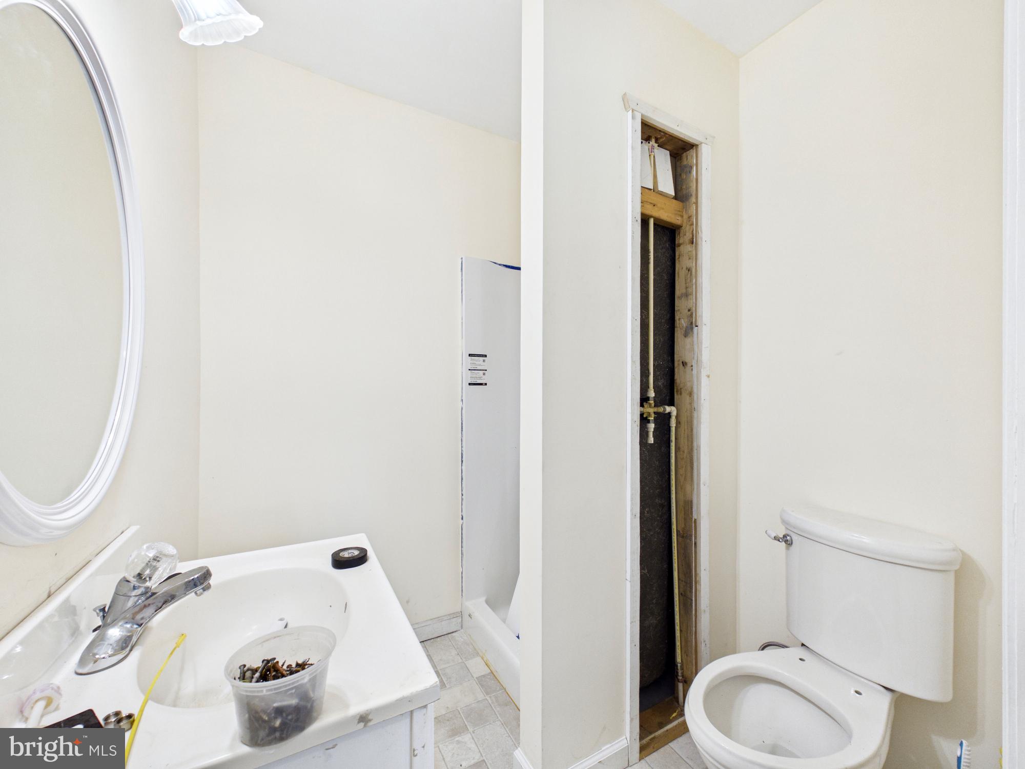324 Jebb Road Camden Wyoming, DE 19934 - Photo 12 of 49 a bathroom with a sink a toilet and a mirror