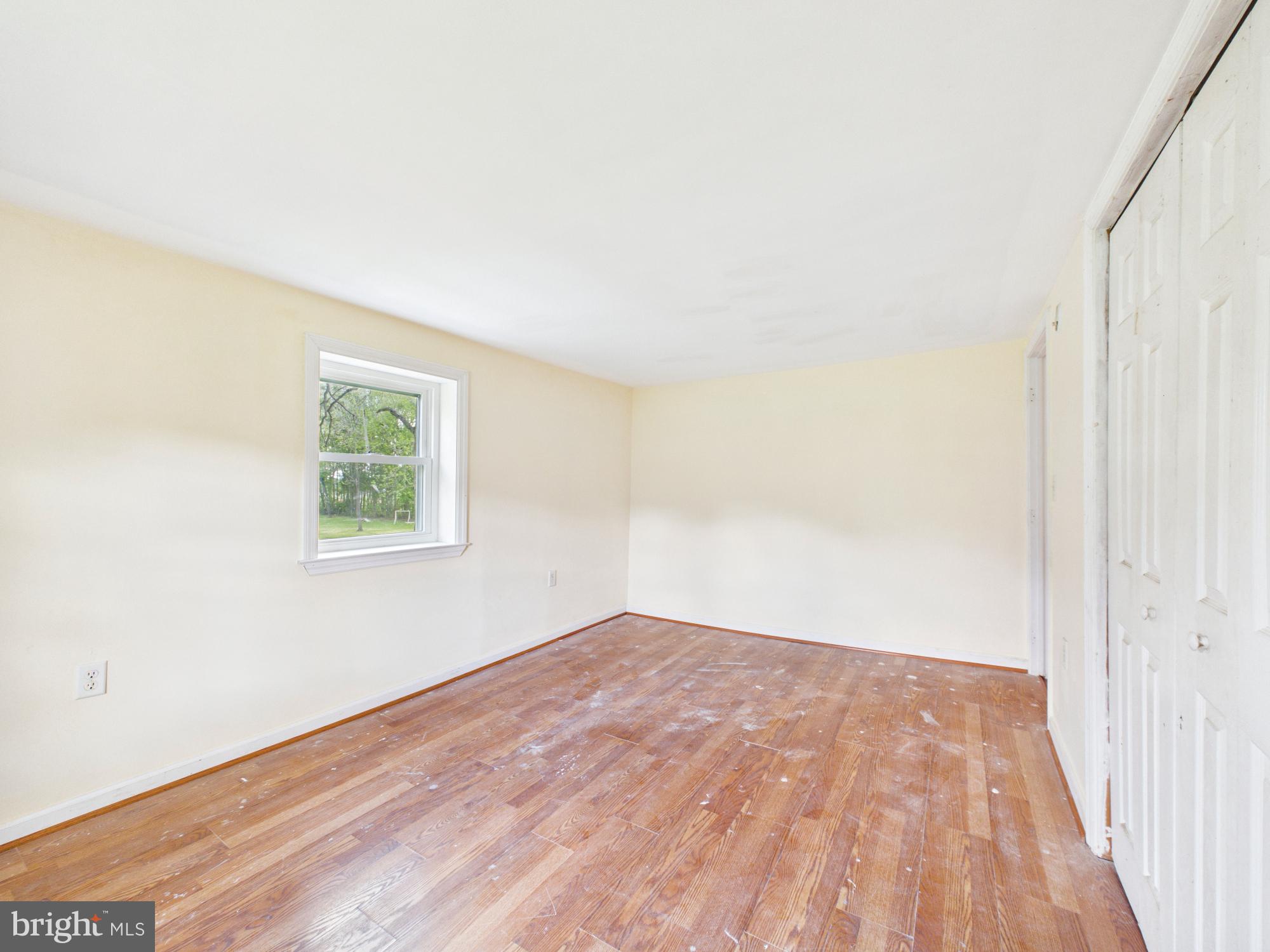 324 Jebb Road Camden Wyoming, DE 19934 - Photo 21 of 49 an empty room with wooden floor and windows