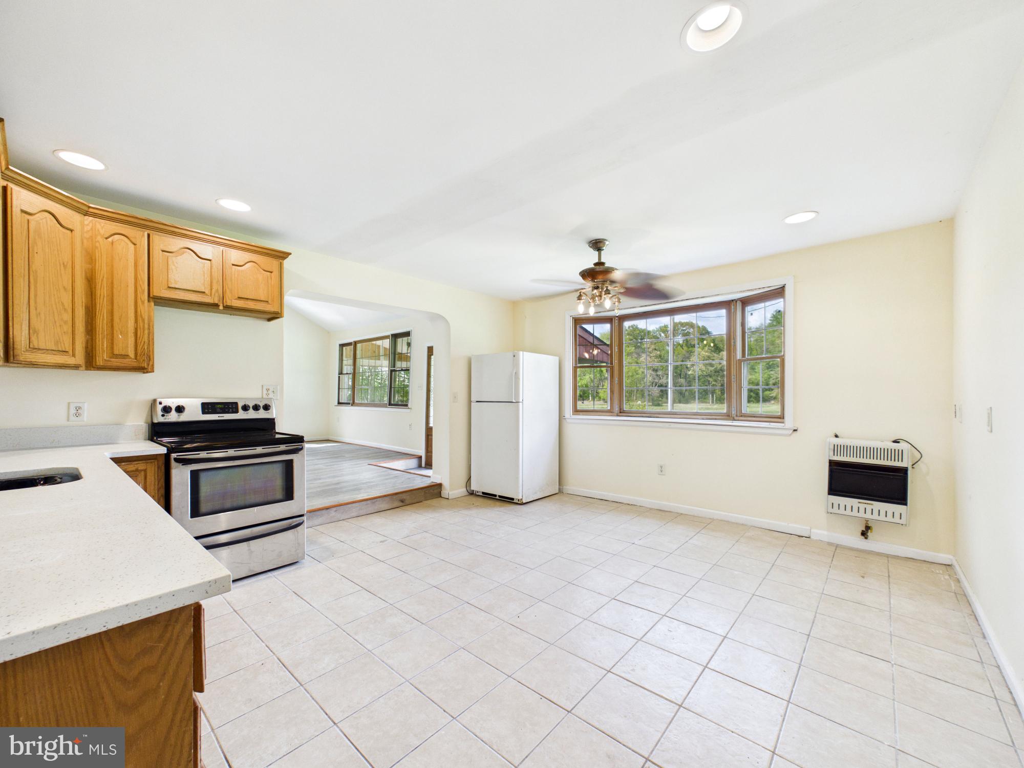 324 Jebb Road Camden Wyoming, DE 19934 - Photo 6 of 49 a kitchen with granite countertop a stove and a refrigerator