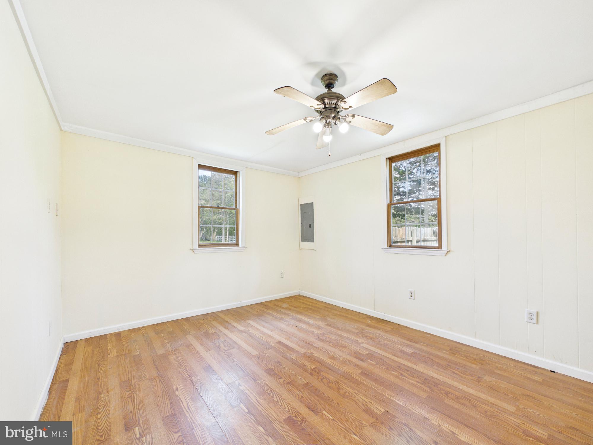 324 Jebb Road Camden Wyoming, DE 19934 - Photo 9 of 49 a view of empty room with wooden floor and fan