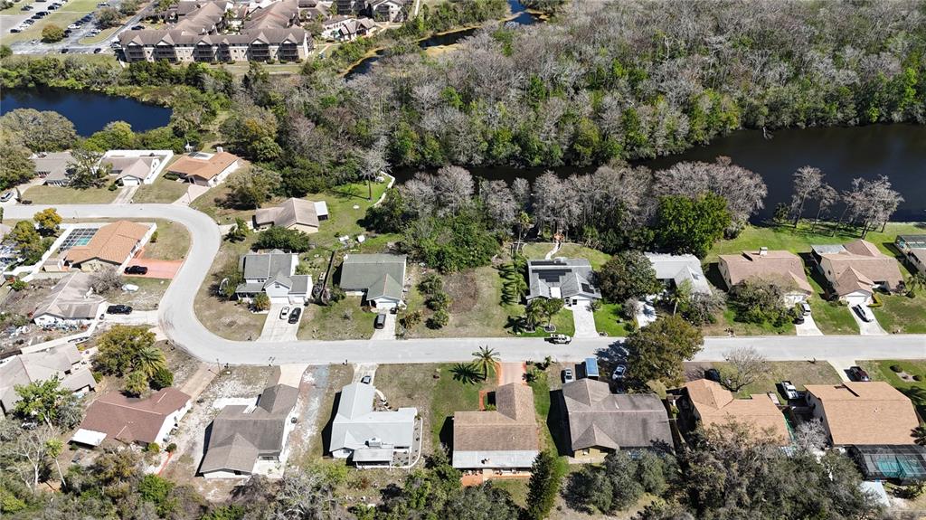 Whitby Road Hudson, FL 34667 - Photo 15 of 28 an aerial view of residential house with outdoor space and lake view