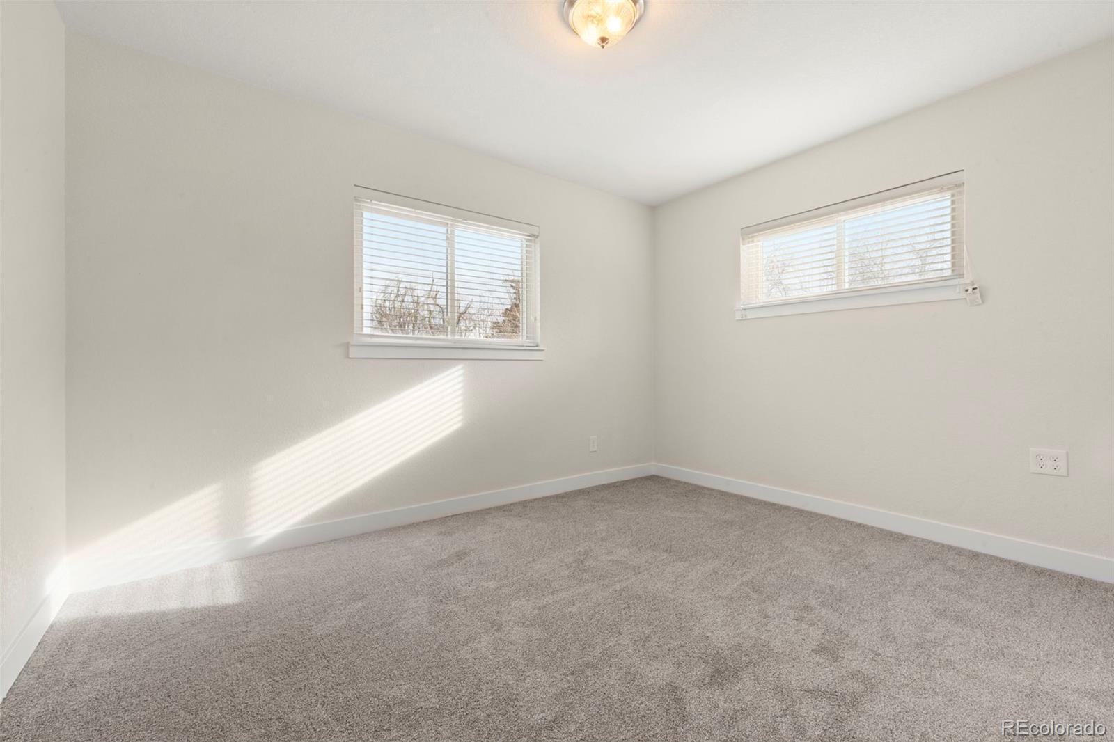 1216 Ursula Street Aurora, CO 80011 - Photo 18 of 30 an empty room with a window