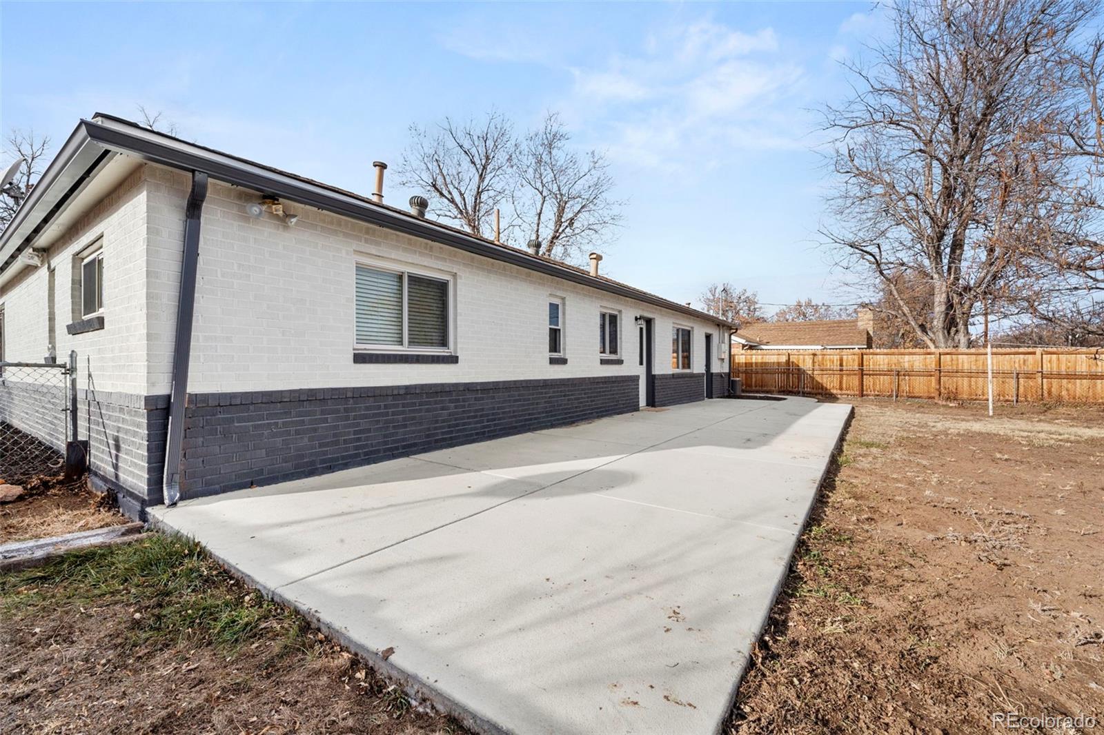 1216 Ursula Street Aurora, CO 80011 - Photo 5 of 30 a view of a house with a yard