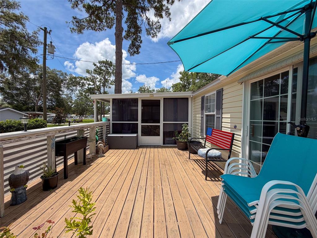 2092 Culbreath Road, Unit A42 Brooksville, FL 34602 - Photo 12 of 70 a view of roof deck with wooden floor and seating space