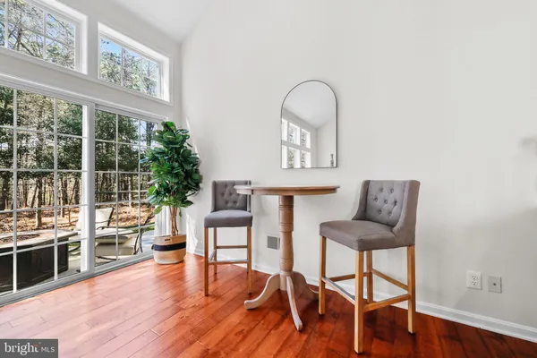 a view of a livingroom with furniture and workspace
