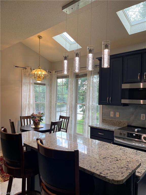 2836 Pickering Road Greensboro, NC 27407 - Photo 13 of 44 Kitchen with skylights