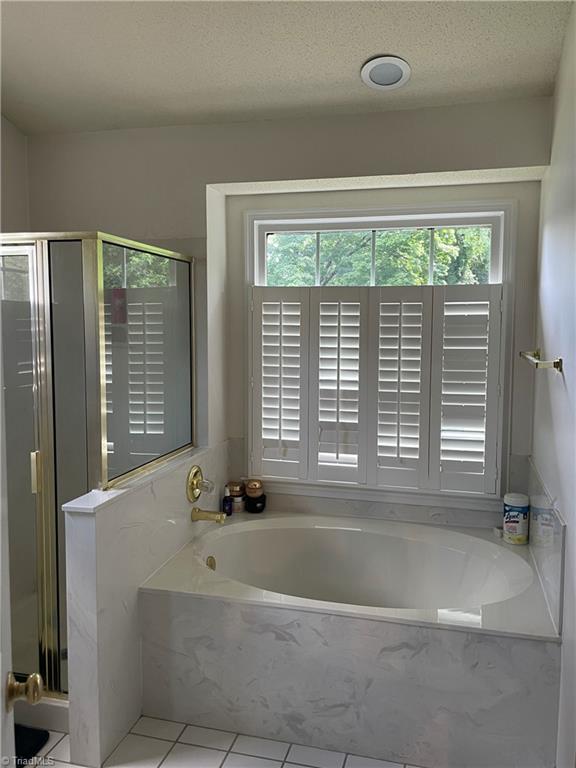2836 Pickering Road Greensboro, NC 27407 - Photo 21 of 44 Spa tub in ensuite