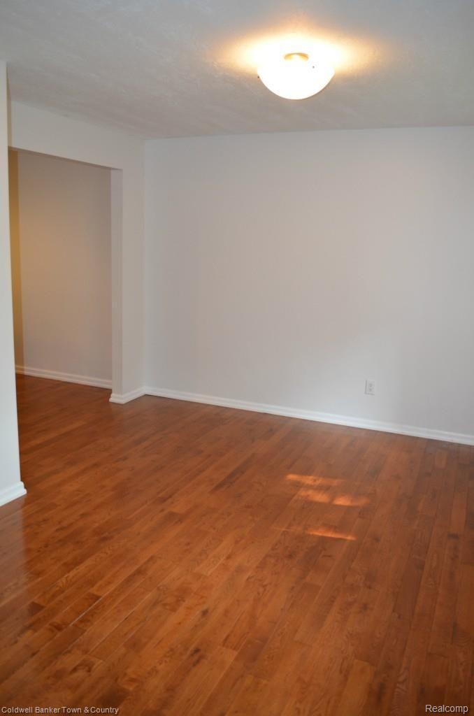 4997 Culver Road Brighton, MI 48114 - Photo 12 of 28 Dining Room with Beautiful Hardwood Floors