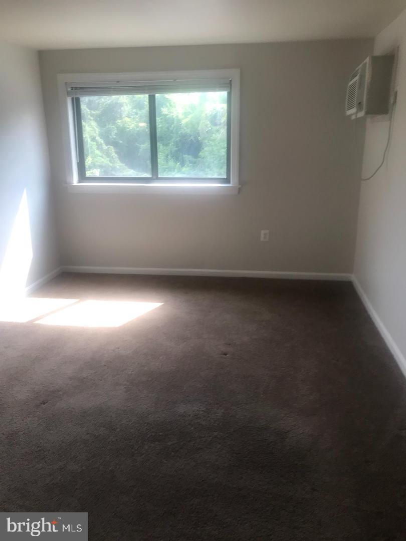 3107 Naylor Road Southeast, Unit 203 Washington, DC 20020 - Photo 4 of 8 an empty room with a window