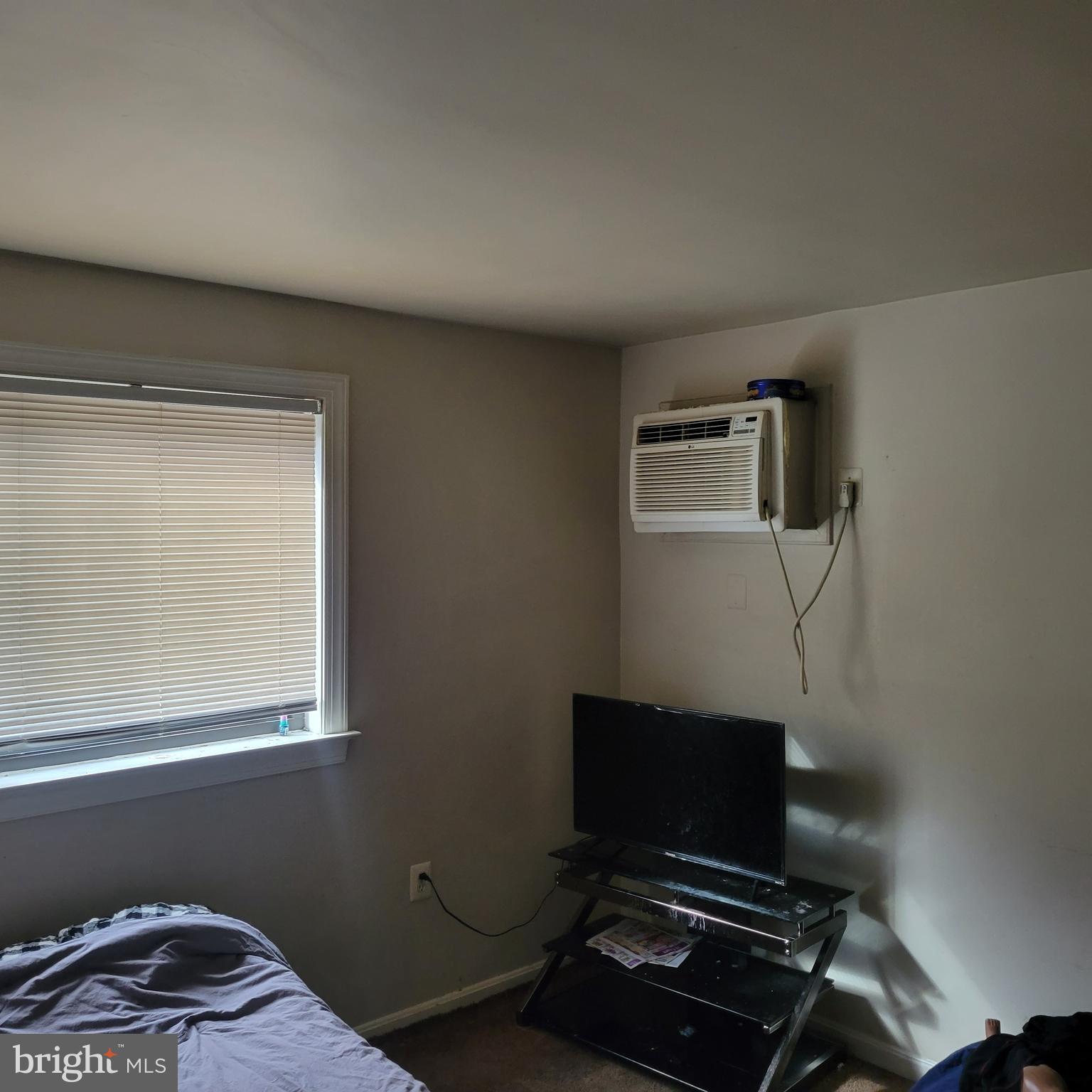 3107 Naylor Road Southeast, Unit 203 Washington, DC 20020 - Photo 7 of 8 a room with furniture and a window