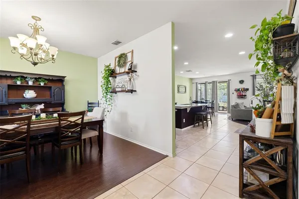 a kitchen with stainless steel appliances kitchen island granite countertop a refrigerator and a stove top oven