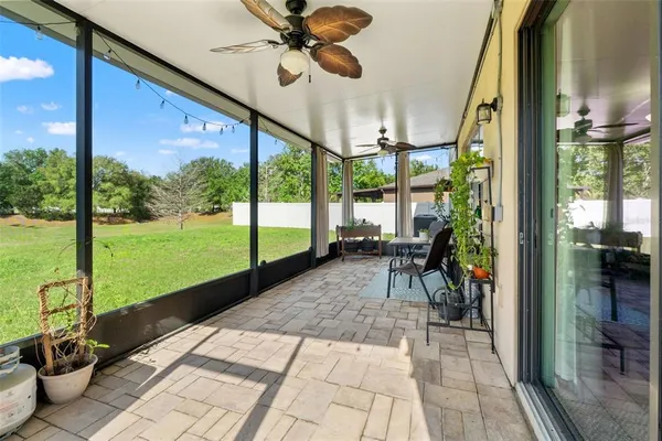 a view of yard with swimming pool and green space