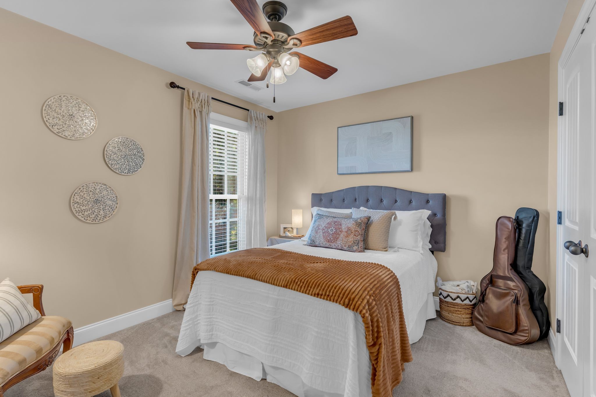 1688 Porter Road Bon Aqua, TN 37025 - Photo 14 of 38 a bedroom with a bed and a chair