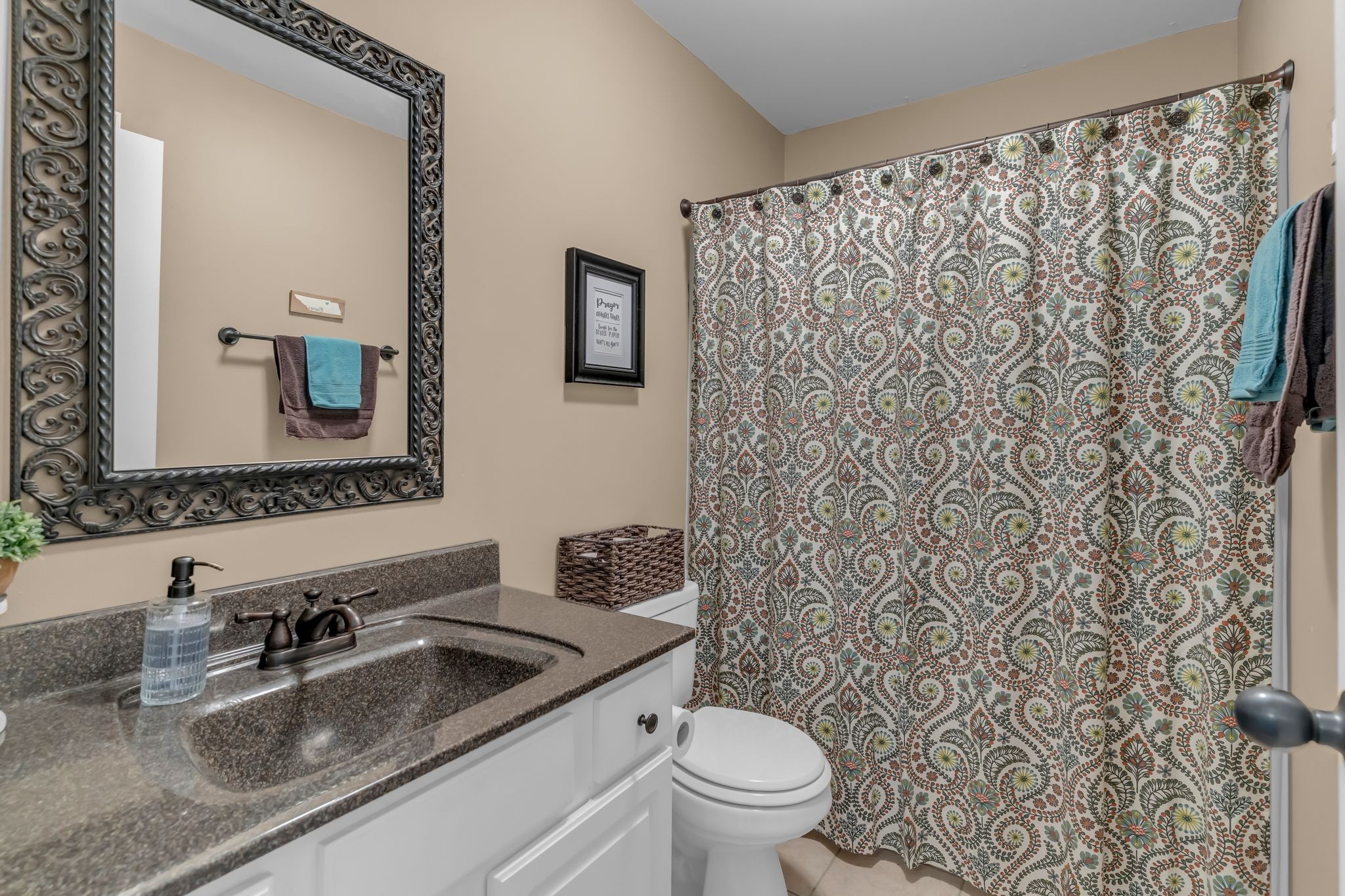 1688 Porter Road Bon Aqua, TN 37025 - Photo 16 of 38 a bathroom with a toilet sink and mirror