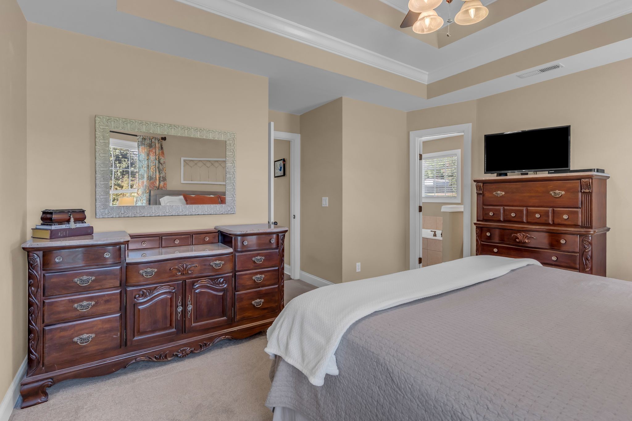 1688 Porter Road Bon Aqua, TN 37025 - Photo 21 of 38 a bedroom with a bed and a television