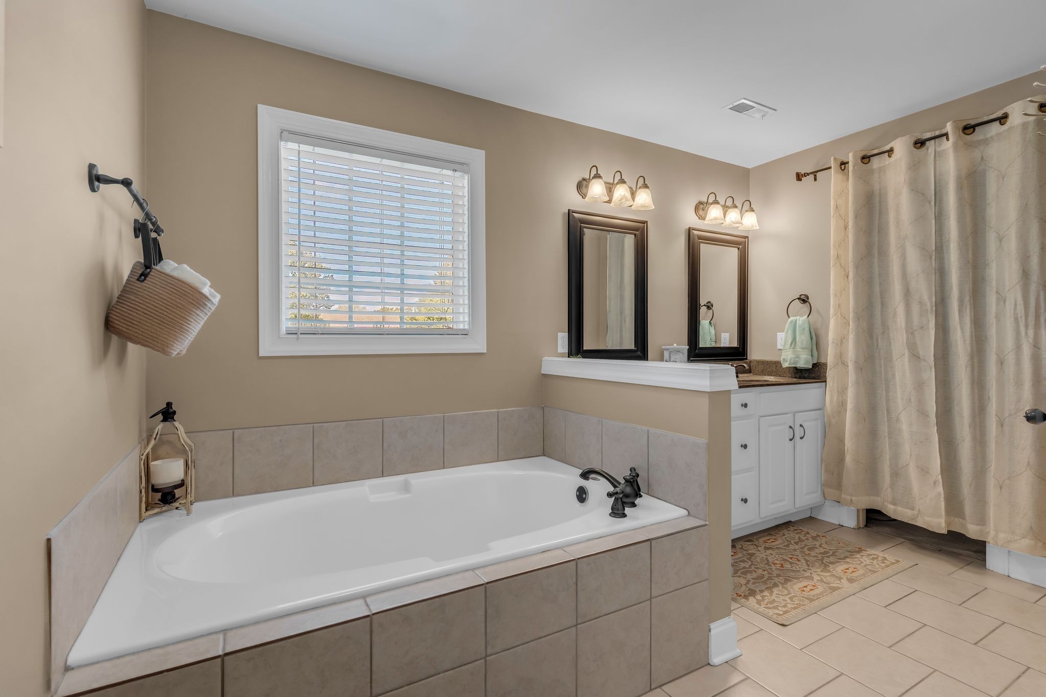 1688 Porter Road Bon Aqua, TN 37025 - Photo 23 of 38 a bathroom with a bathtub and a sink