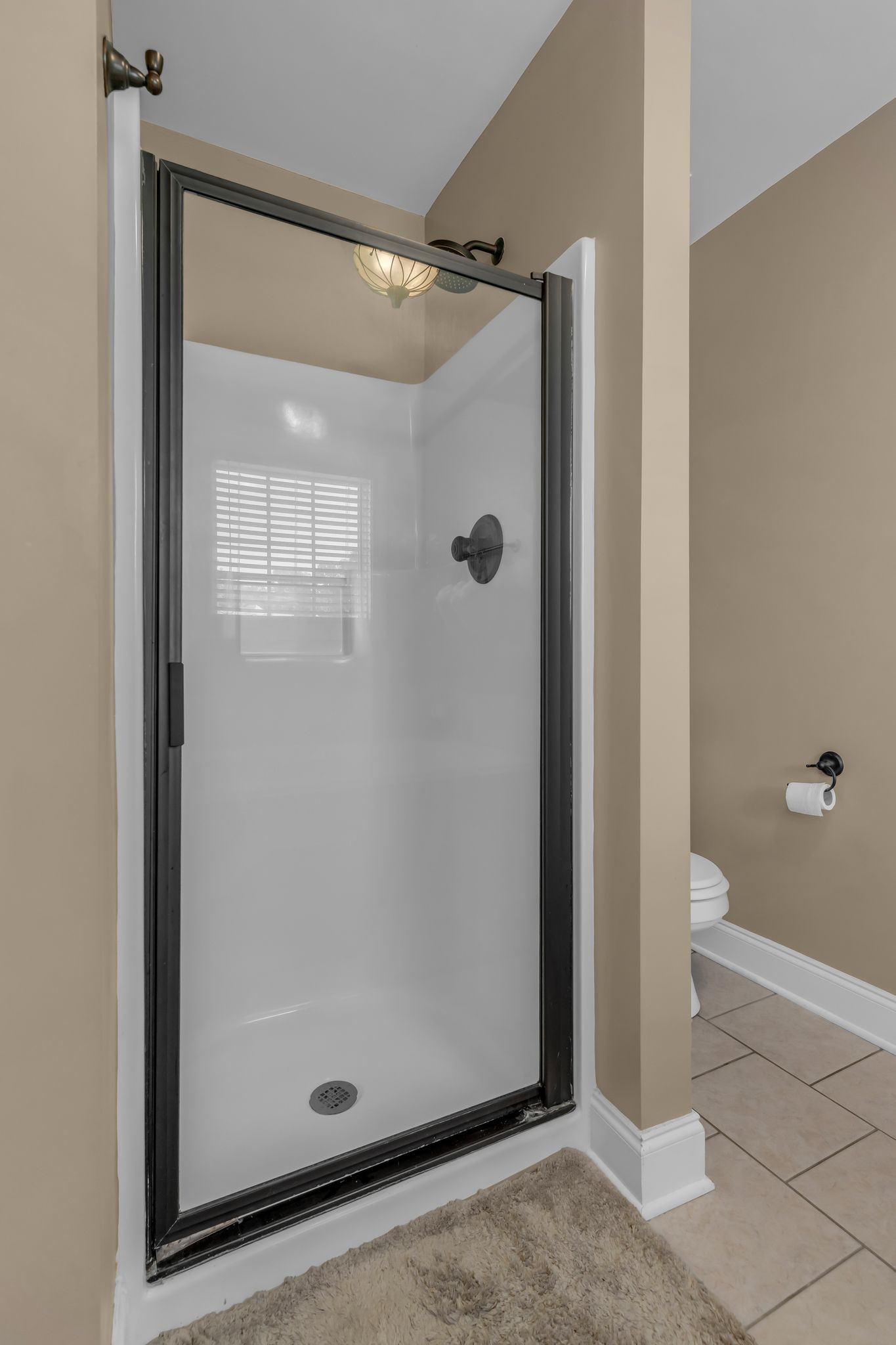 1688 Porter Road Bon Aqua, TN 37025 - Photo 24 of 38 a bathroom with a glass shower door