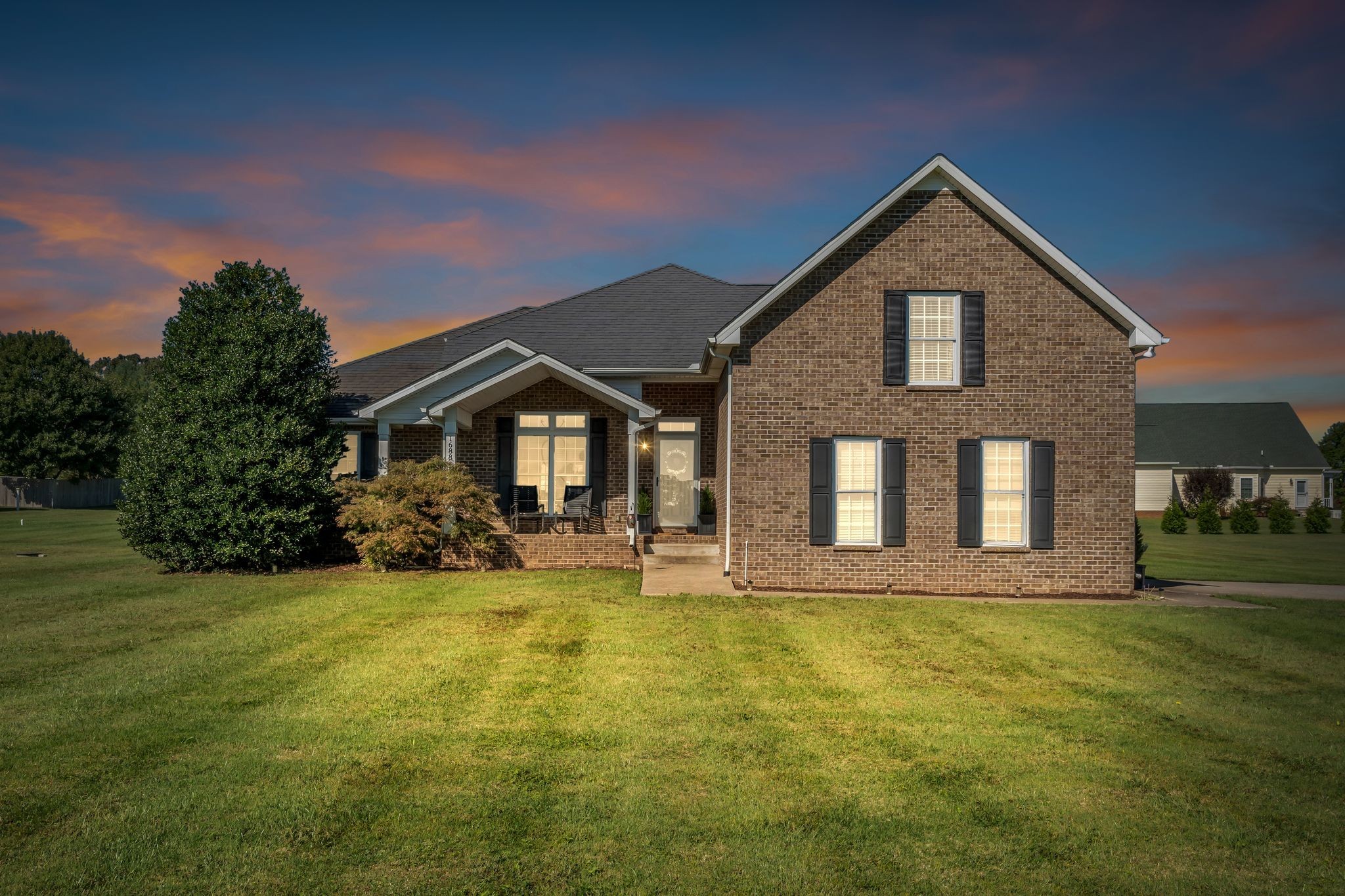 1688 Porter Road Bon Aqua, TN 37025 - Photo 36 of 38 a front view of a house with garden