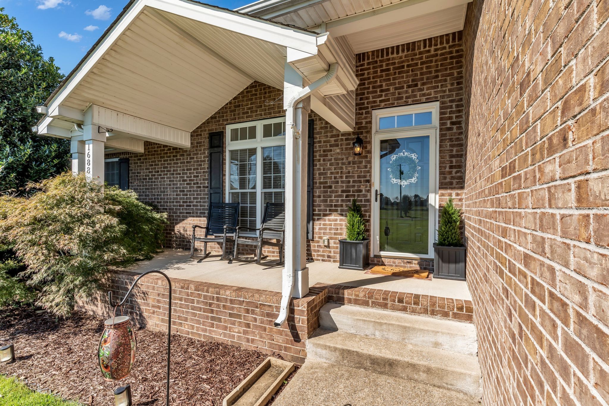 1688 Porter Road Bon Aqua, TN 37025 - Photo 4 of 38 front view of house with a bench