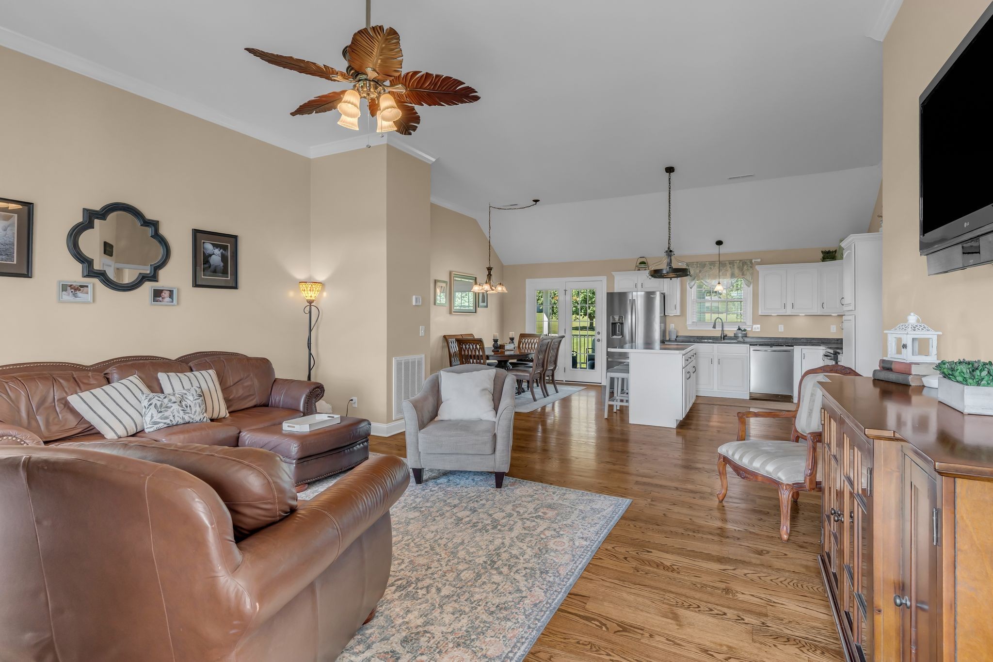 1688 Porter Road Bon Aqua, TN 37025 - Photo 5 of 38 a living room with furniture and a flat screen tv