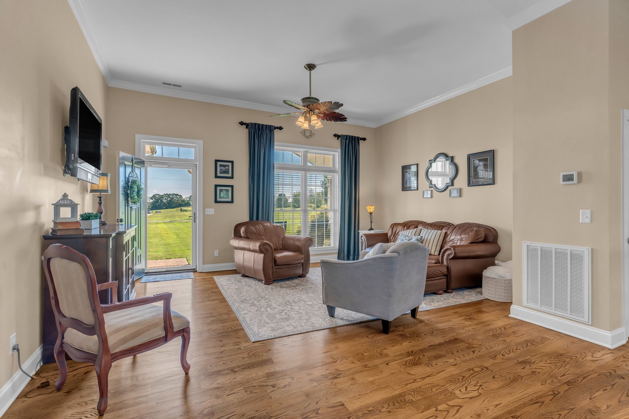 1688 Porter Road Bon Aqua, TN 37025 - Photo 6 of 38 a living room with furniture fireplace and flat screen tv