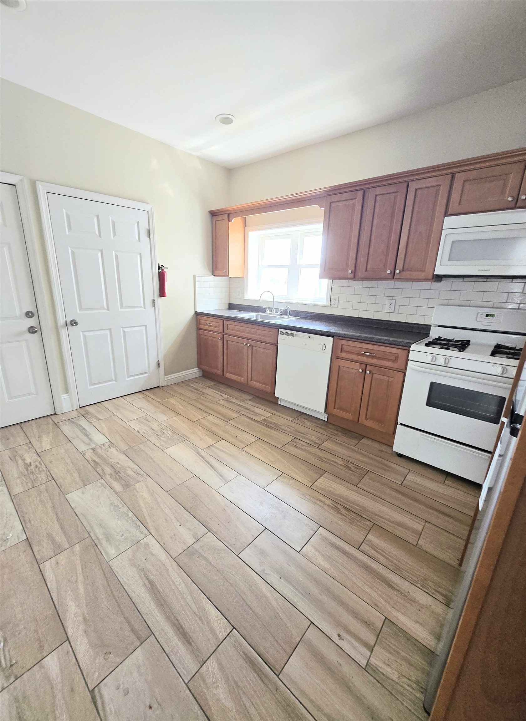 316 Devon Street, Unit 2 Kearny, NJ 07032 - Photo 4 of 9 a bedroom with a bed and a window