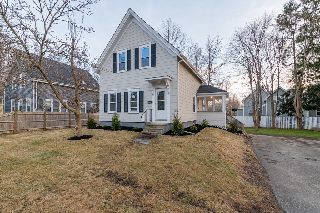 36 Cherry Street Whitman, MA 02382 - Photo 2 of 35 a view of a house with a yard covered in snow