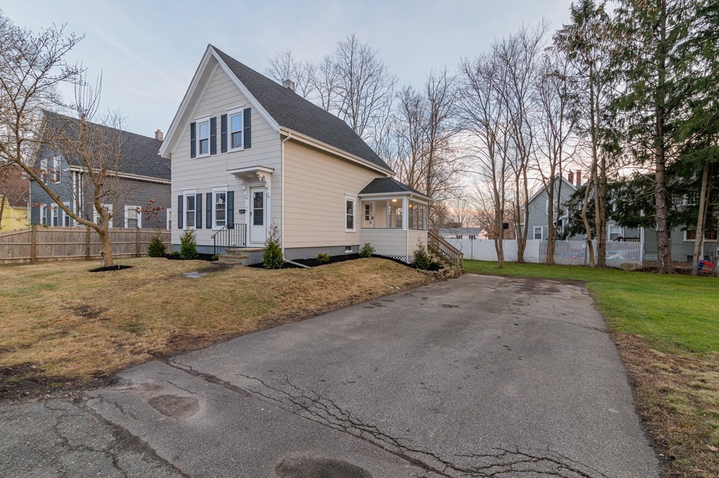36 Cherry Street Whitman, MA 02382 - Photo 3 of 35 a view of a white house next to a yard with big trees