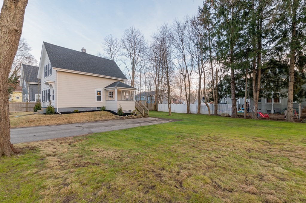 36 Cherry Street Whitman, MA 02382 - Photo 4 of 35 a view of a house with a big yard and large tree