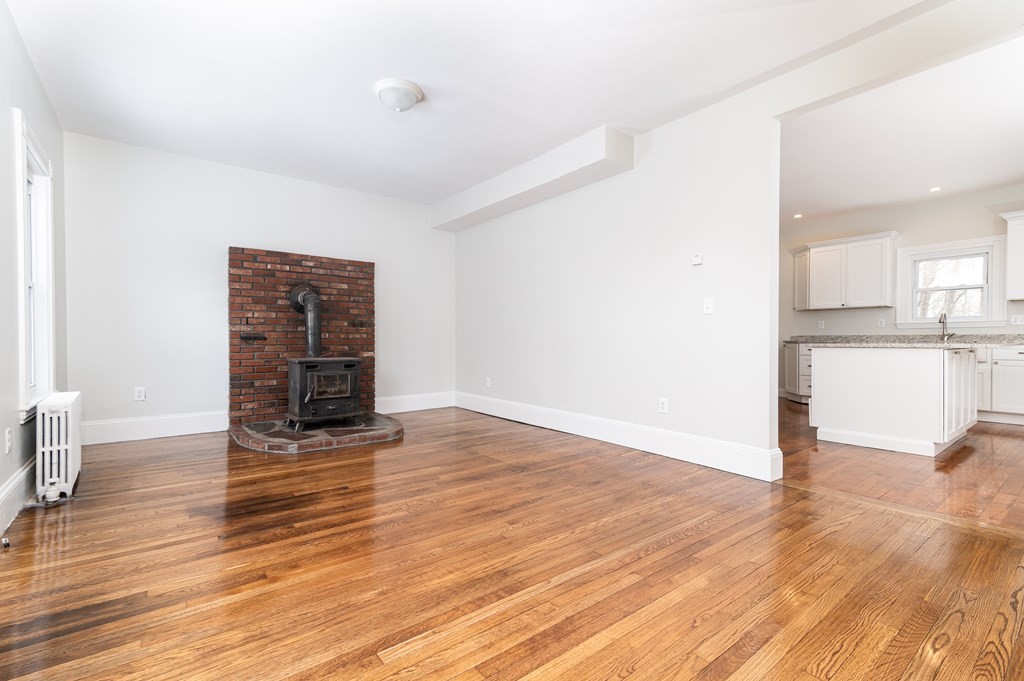 36 Cherry Street Whitman, MA 02382 - Photo 6 of 35 a view of empty room with wooden floor