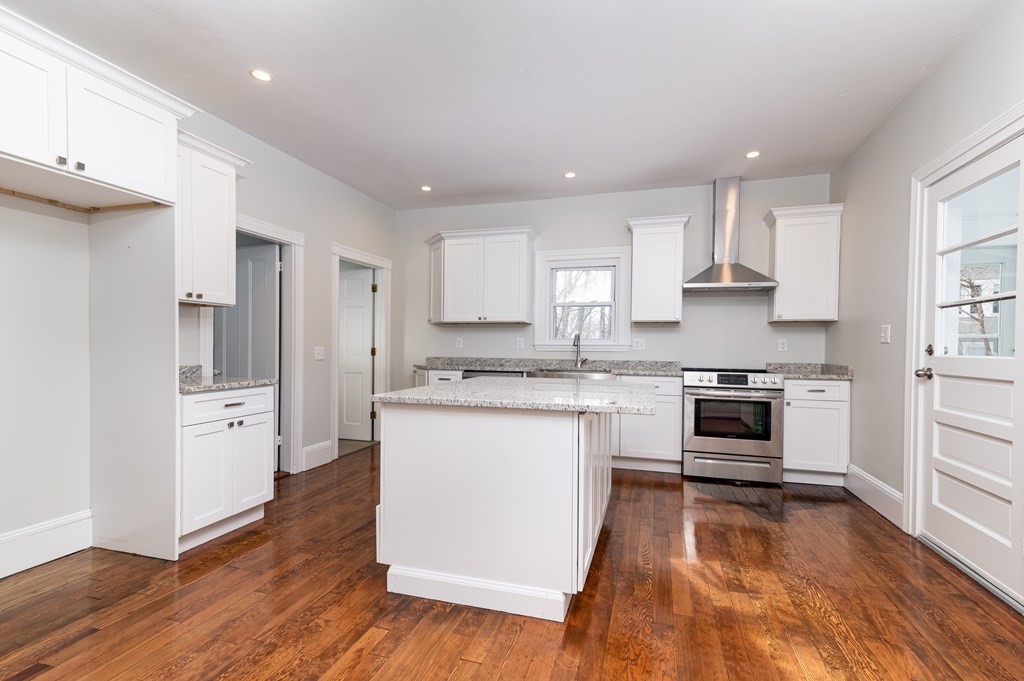 36 Cherry Street Whitman, MA 02382 - Photo 8 of 35 a kitchen with a white stove top oven and refrigerator