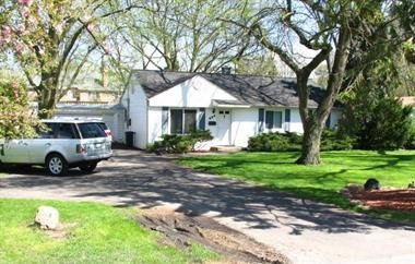 223 Red Oak Road Northbrook, IL 60062 - Photo 1 of 1 a front view of a house with garden