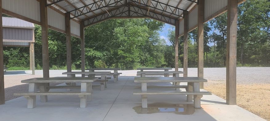 2427 Hardin Bottom River Road Clifton, TN 38425 - Photo 20 of 31 a patio with table and chairs