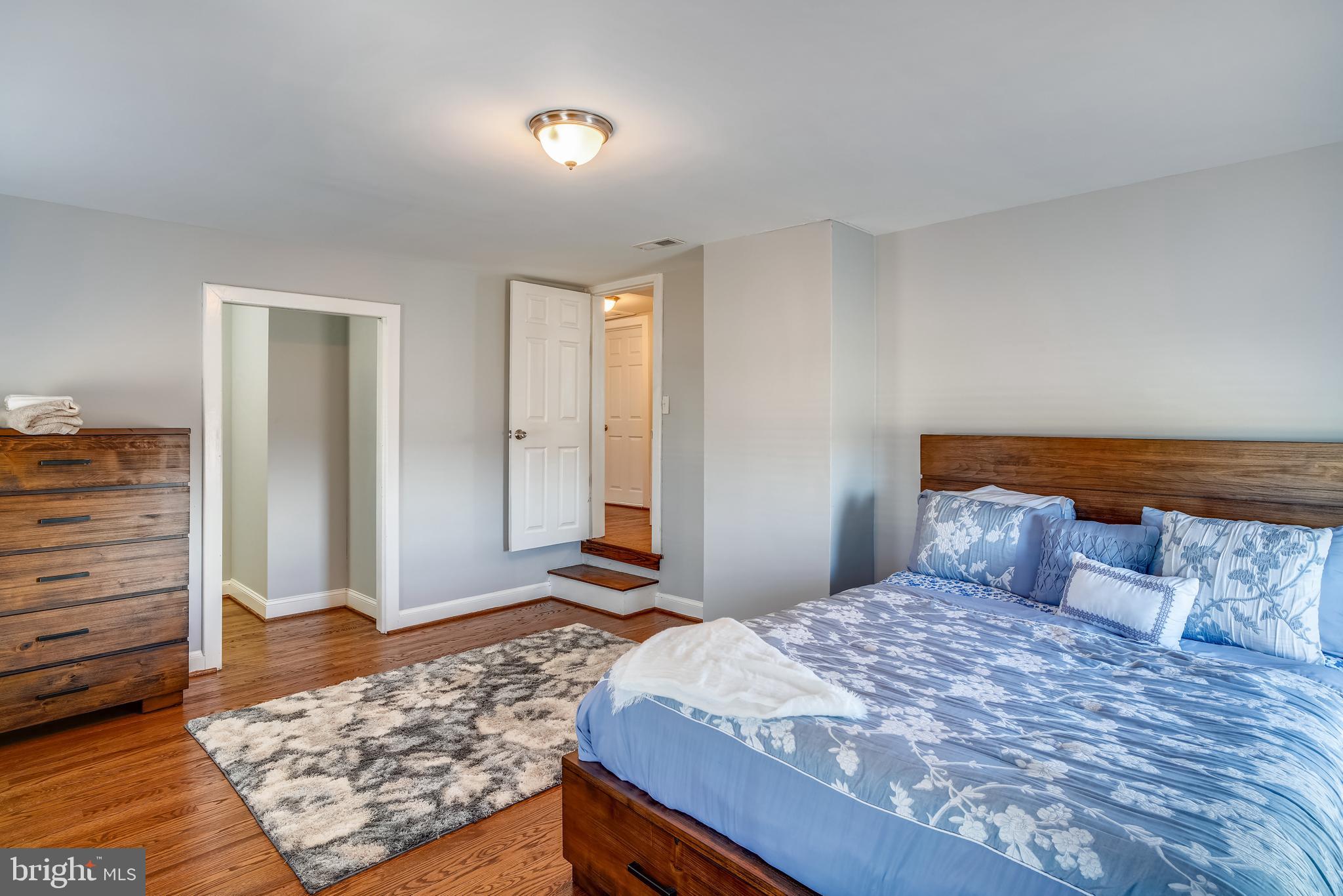 5320 Turkey Run Road Warrenton, VA 20187 - Photo 18 of 29 a bedroom with a bed and wooden floor