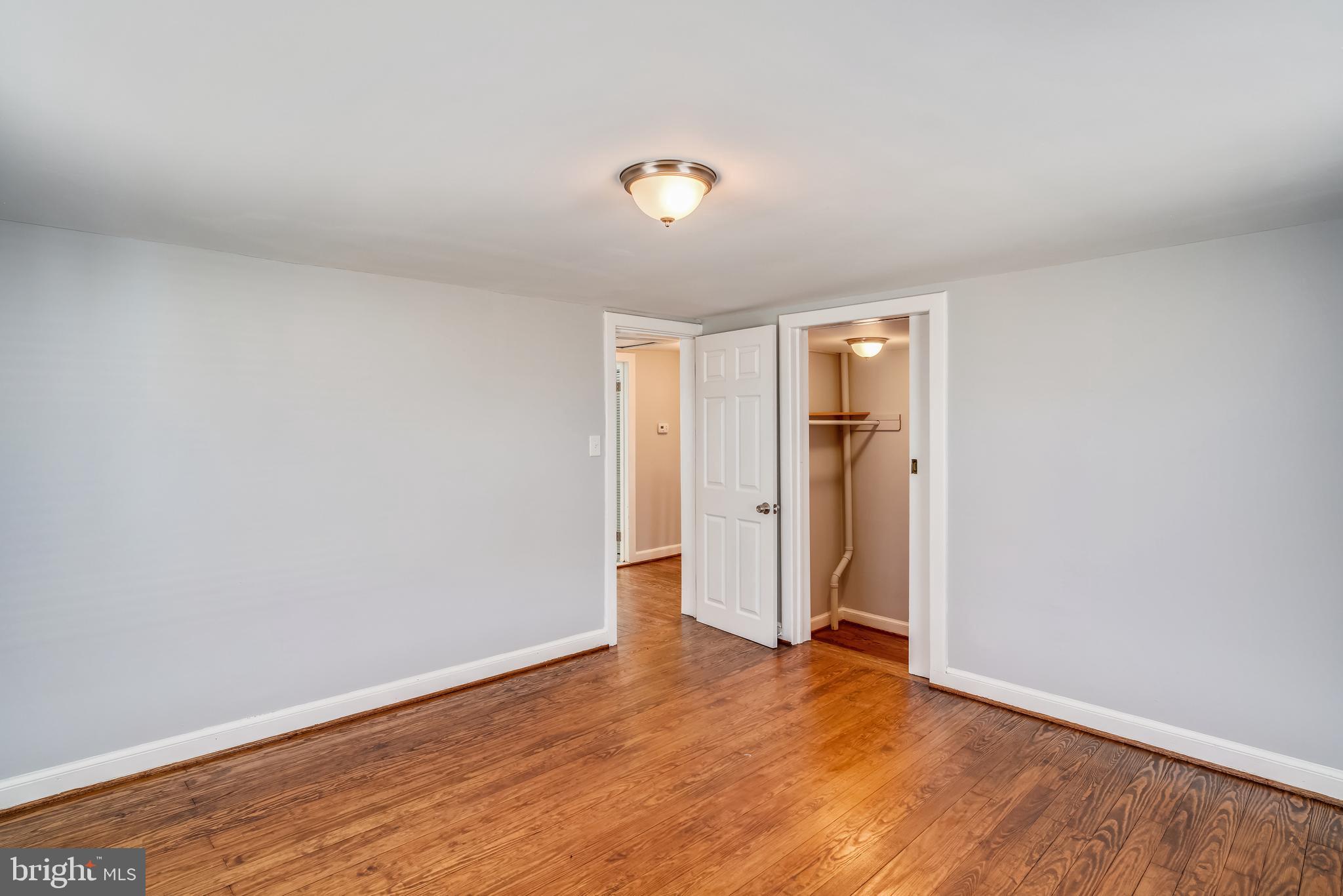 5320 Turkey Run Road Warrenton, VA 20187 - Photo 20 of 29 a view of an empty room with wooden floor and closet