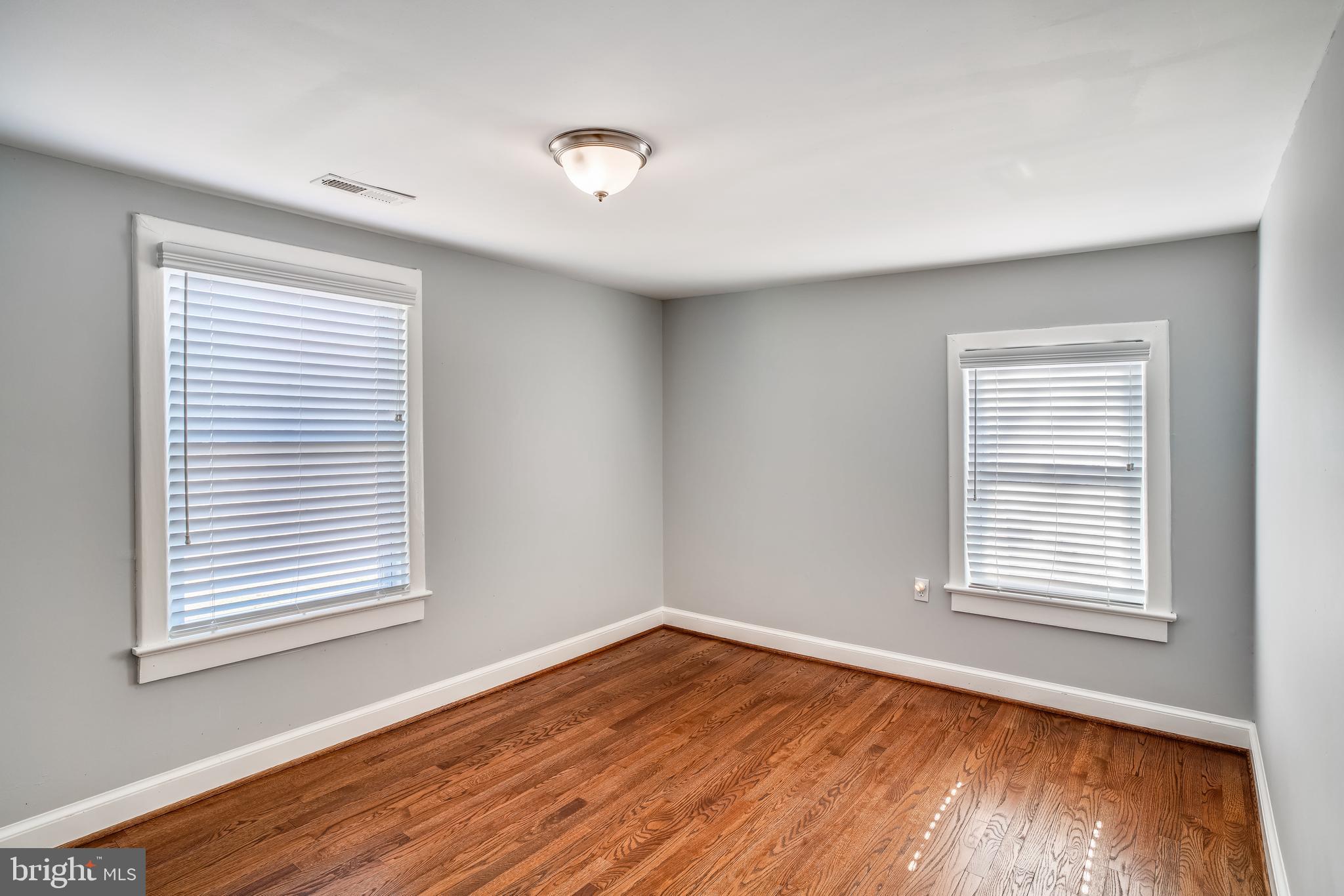 5320 Turkey Run Road Warrenton, VA 20187 - Photo 21 of 29 a view of an empty room with wooden floor and a window
