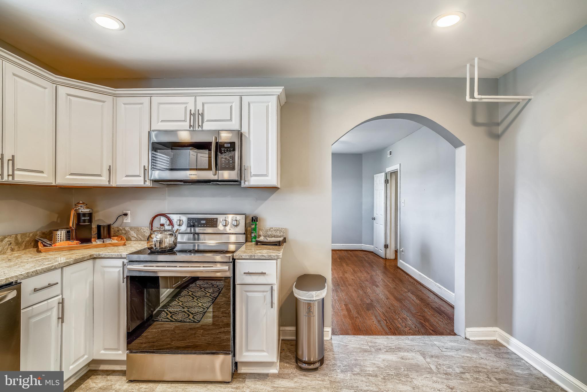 5320 Turkey Run Road Warrenton, VA 20187 - Photo 5 of 29 a kitchen with stainless steel appliances granite countertop a stove a microwave and cabinets