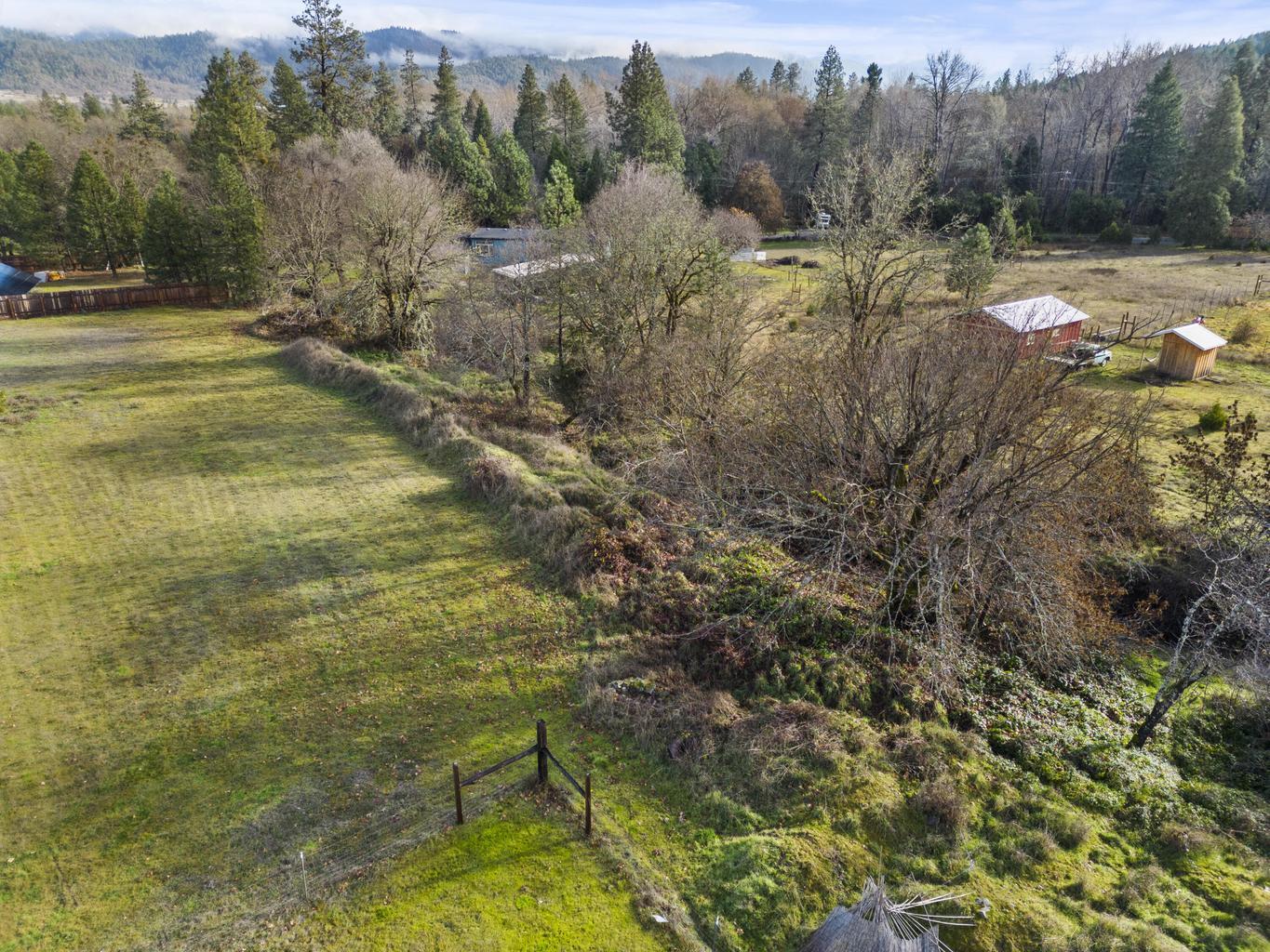 1190 Cedar Flat Road Williams, OR 97544 - Photo 40 of 45 a view of a yard with an outdoor space