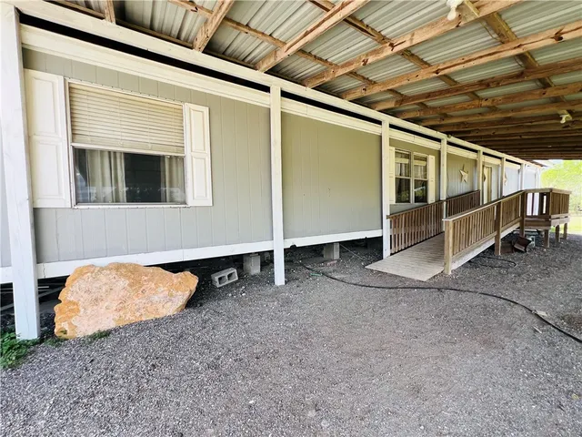 a view of front door and wooden fence