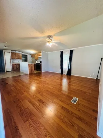 a view of a livingroom with wooden floor